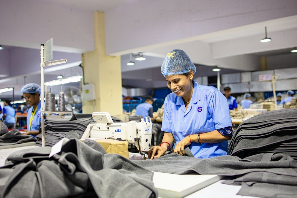 Workers sewing garments